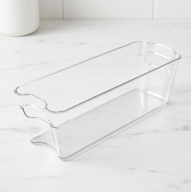 Long transparent organizer, ideal for arranging items in the fridge or cabinets.