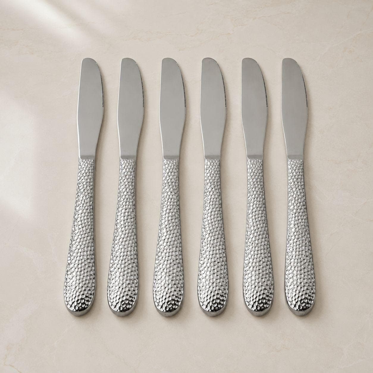 6-piece stainless steel dining knife set with a stylish hammered design, ideal for daily use and serving.